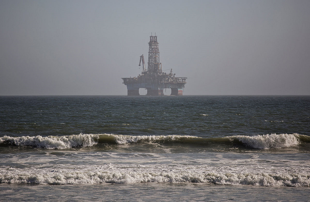 An oil-drilling rig, operating out of Angola, is seen in the waters outside Walvis Bay for maintenance on June 24, 2017. PHOTO: AFP