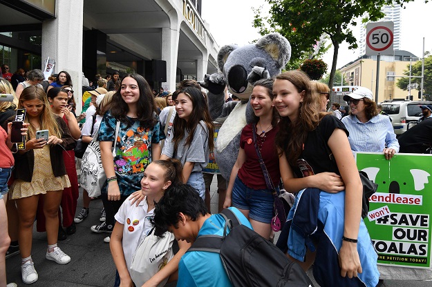Students during a rally calling for action on climate change in front of the Liberal Party headquarters in Sydney. PHOTO: AFP