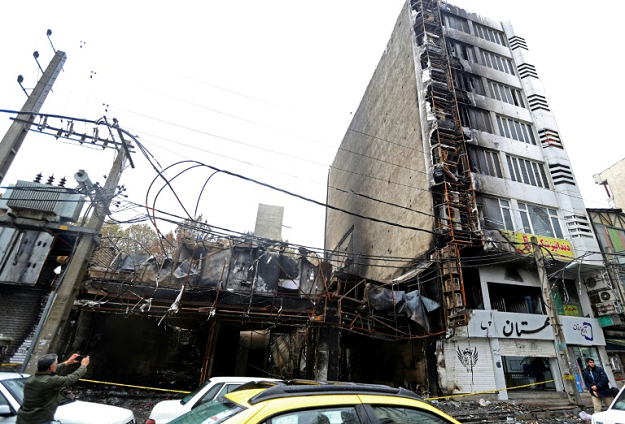 Shops were torched and destroyed during demonstrations against petrol price hikes since last Friday. PHOTO: AFP