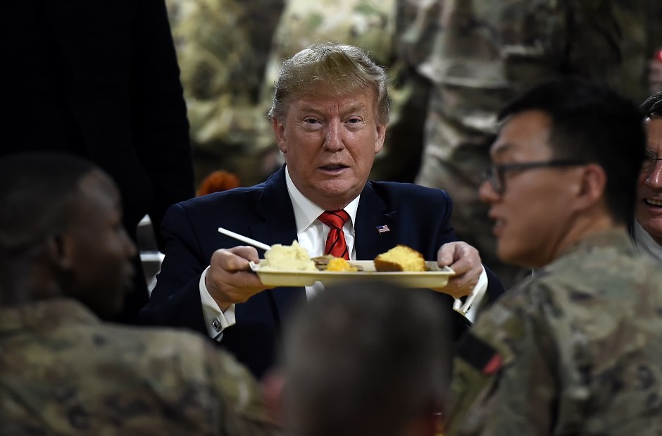 US President Donald Trump enjoying his Thanksgiving dinner to visit US troops at Bagram Air Field. PHOTO: AFP