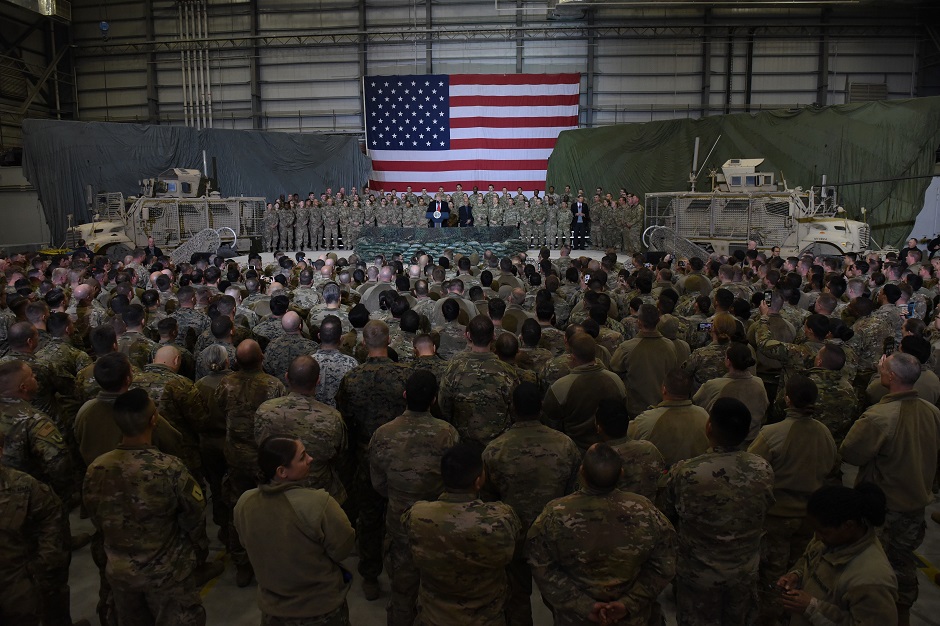 Afghan's President Ashraf Ghani and US President Donald Trump speak to US soldiers during a surprise Thanksgiving day visit at Bagram Air Field. PHOTO: AFP