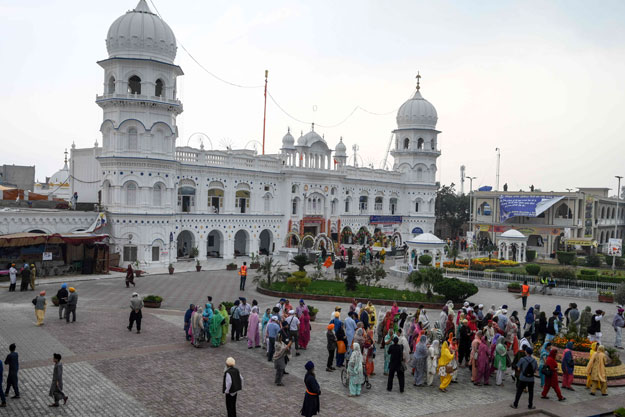 Sikh pilgrims visit the shrine in Nankana Sahib, some 75 kms west of Lahore on November 7, 2019, on the occasion of the 550th birth anniversary of Guru Nanak Dev. - A corridor that will allow Sikhs to cross from India into Pakistan to visit one of the religion's holiest sites is set to open on November 9, with thousands expected to make a pilgrimage interrupted by decades of conflict. PHOTO: AFP