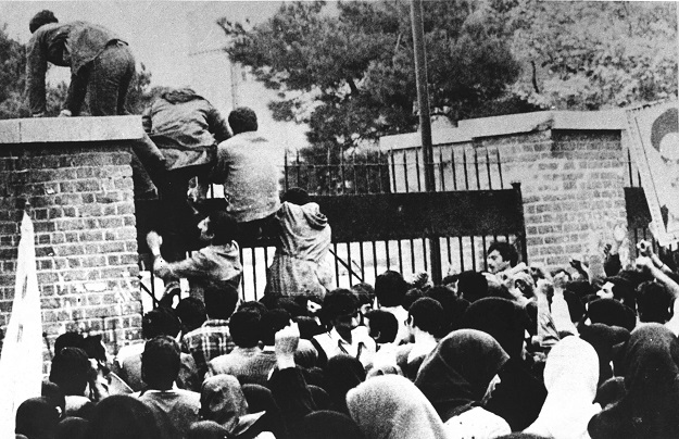 A file photo taken on November 04, 1979 shows Iranian revolutionary students climbing the US embassy's gate in Tehran (Photo: AFP)