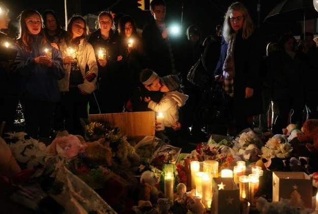 New London, Connecticut residents attend a memorial on December 16, 2012 for victims of the Sandy Hook Elementary School shooting. PHOTO: AFP