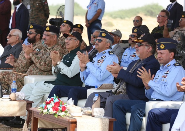 President of Pakistan Dr Arif Alvi along with Governor Sindh Imran Ismail, General Zubair Hayat , Chairman Joint Chief of staff Committee and Air Chief Marshall Mujahid Anwar Khan witnessing the aerobatics of Sherdil team. PHOTO: PAF