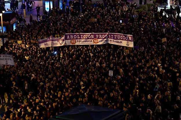 People attend a demonstration to mark the International Day for the Elimination of Violence against Women in Madrid. PHOTO: AFP