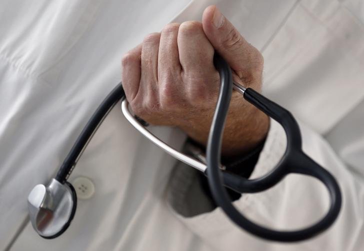 A Reuters file photo of a doctor holding stethoscope. 