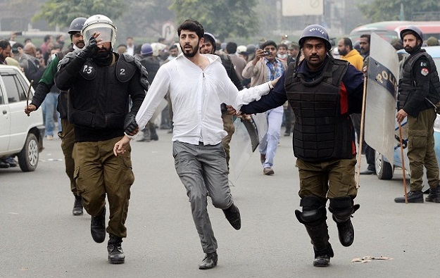 Police arrested lawyers during a clash between doctors and legal faternity at the Punjab Institute of Cardiology in provincial capital. PHOTO: ONLINE