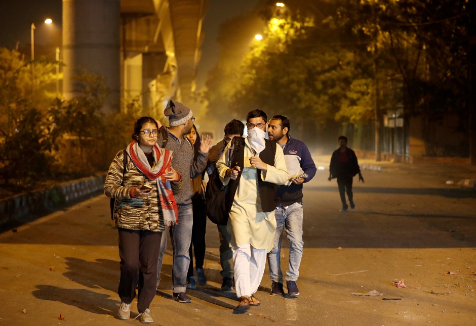  Students leave the Jamia Milia University following a protest against a new citizenship law. PHOTO: REUTERS 