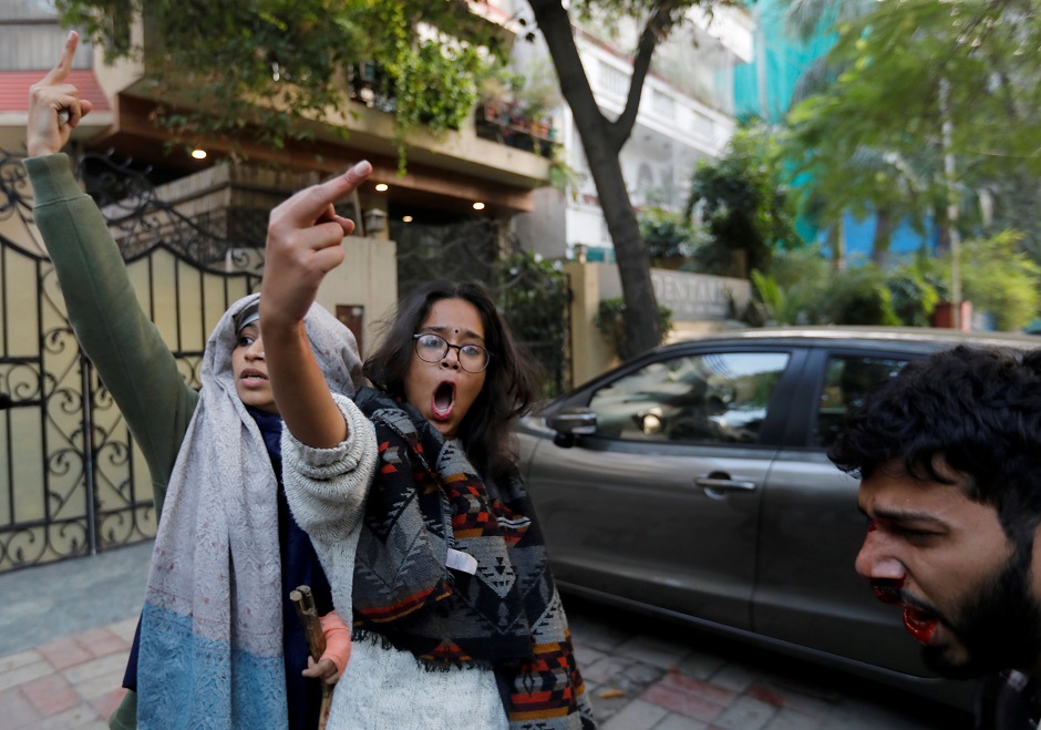  Demonstrators flip the bird during a protest against a new citizenship law, in New Delhi. PHOTO: REUTERS 