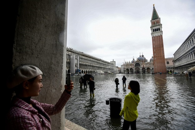 Extreme weather events also saw floods in Venice this year. PHOTO: AFP 