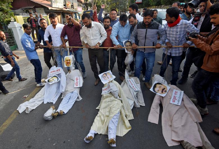 Demonstrators carry effigies during a protest against the Citizenship Amendment Bill, a bill that seeks to give citizenship to religious minorities persecuted in neighbouring Muslim countries, in Guwahati. PHOTO: Reuters