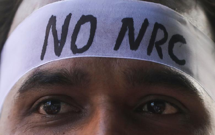 A man wearing a headband attends a protest march against a new citizenship law, on the outskirts of Mumbai, India. PHOTO: Reuters