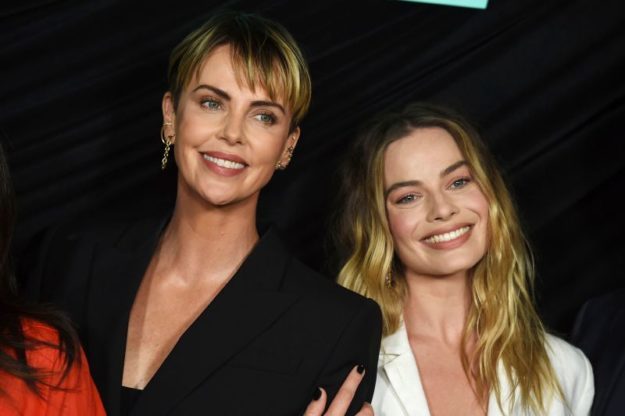 Mandatory Credit: Photo by Jordan Strauss/Invision/AP/Shutterstock (10443399f) Margot Robbie, Charlize Theron. Cast members Charlize Theron, left, who plays Megyn Kelly, and Margot Robbie, who plays Kayla Pospisil, pose at a Los Angeles special screening of 