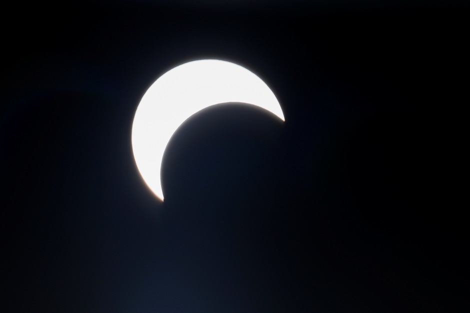 A partial solar eclipse is pictured along Clifton beach in Karachi. PHOTO: Reuters