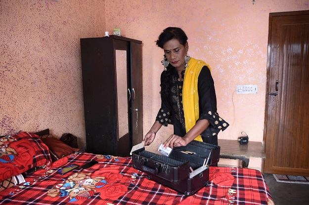 Freelance make-up artist Tulsi Chandra arranges her make-up box in New Delhi. PHOTO: AFP