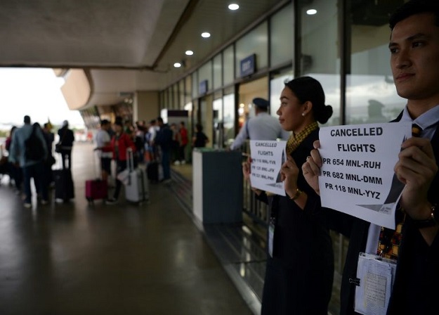 Typhoon Kammuri has forced the cancellation of hundreds of flights at Manila's international airport.PHOTO: AFP 