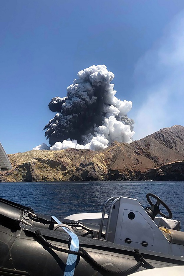 This handout photo taken on December 9, 2019 and provided courtesy of Lillani Hopkins through her Facebook account on December 12 shows a plume of ash rising into the air as the volcano on White Island erupts off the coast of Whakatane on New Zealand's North Island.