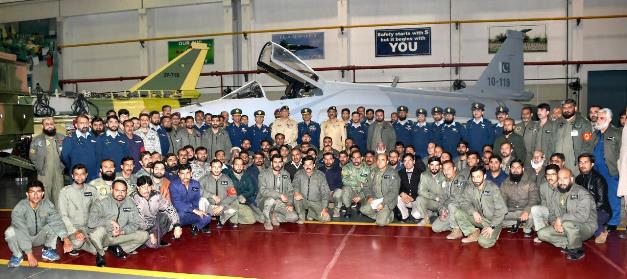 General Qamar Javed Bajwa poses for a group photo during his visit to the Pakistan Aeronautical Complex in Kamra. PHOTO: ISPR