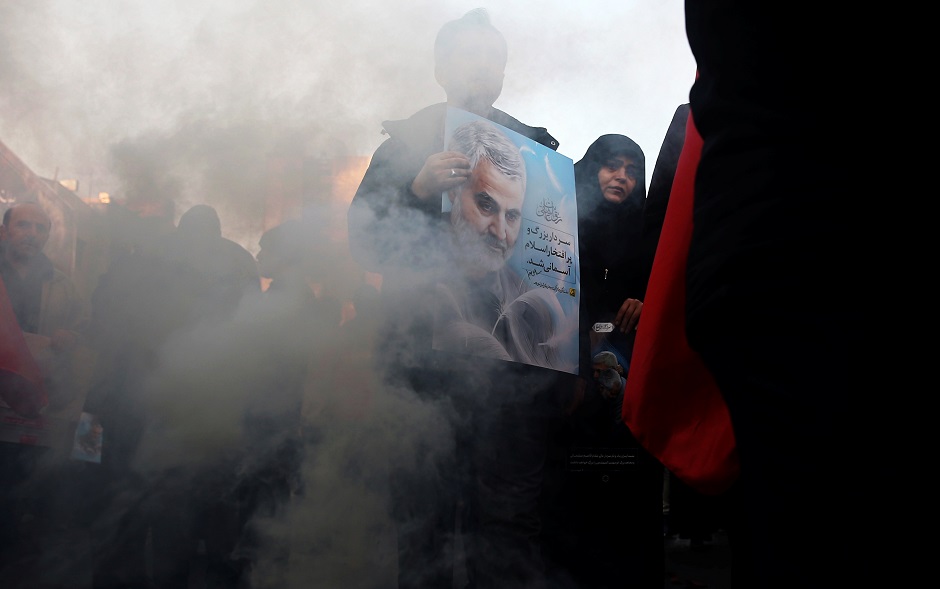 Iranian people attend a funeral procession for Iranian Major-General Qassem Soleimani, head of the elite Quds Force, and Iraqi militia commander Abu Mahdi al-Muhandis, who were killed in an air strike at Baghdad airport, in Tehran, Iran January 6, 2020. PHOTO: REUTERS