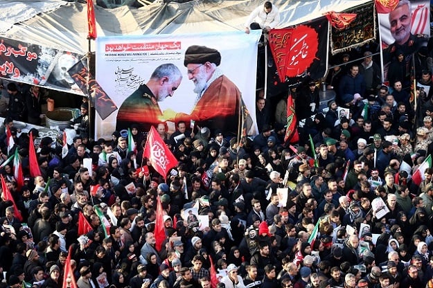 Iranian people attend a funeral procession for Iranian Major-General Qassem Soleimani, head of the elite Quds Force, and Iraqi militia commander Abu Mahdi al-Muhandis, who were killed in an air strike at Baghdad airport, in Tehran, Iran January 6, 2020. PHOTO: REUTERS