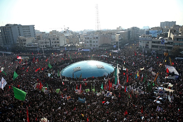 Iranian people attend a funeral procession for Iranian Major-General Qassem Soleimani, head of the elite Quds Force, and Iraqi militia commander Abu Mahdi al-Muhandis, who were killed in an air strike at Baghdad airport, in Tehran, Iran January 6, 2020. PHOTO: REUTERS