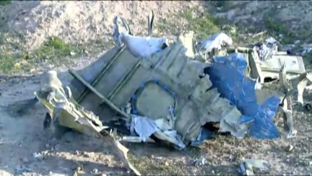 Part of the wreckage from Ukraine International Airlines flight PS752, a Boeing 737-800 plane that crashed after taking off from Tehran's Imam Khomeini airport on January 8, 2020, is seen in this still image taken from Iran Press footage. Iran Press/Handout via REUTERS NO RESALES. NO ARCHIVES. THIS IMAGE HAS BEEN SUPPLIED BY A THIRD PARTY. IRAN OUT. NO COMMERCIAL OR EDITORIAL SALES IN IRAN. NO USE BBC PERSIAN. NO USE MANOTO. NO USE VOA PERSIAN. NO USE IRAN INTERNATIONAL.?