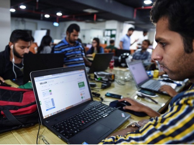 pakistani employees of online marketplace company kaymu at work in karachi photo afp