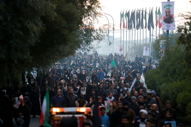 People attend a funeral procession for Iranian Major-General Qassem Soleimani, head of the elite Quds Force, and Iraqi militia commander Abu Mahdi al-Muhandis, who were killed in an air strike at Baghdad airport, in Ahvaz, Iran January 5, 2020. PHOTO: REUTERS