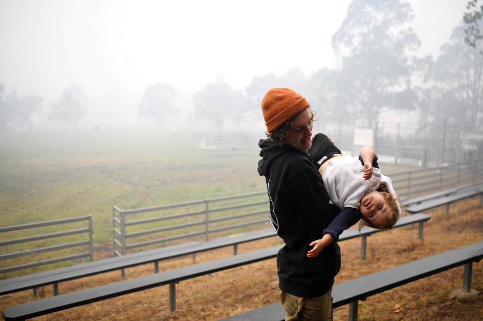 Matthew Harrington and his daughter Uma Harrington play at the Cobargo evacuation centre, after their home was destroyed in the New Year's Eve bushfire in Cobargo, Australia. PHOTO: REUTERS
