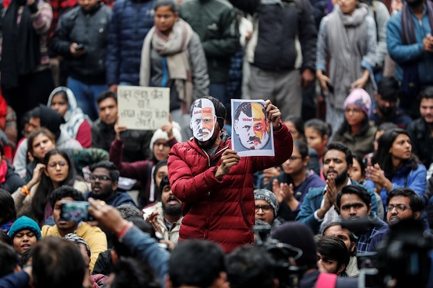 Demonstrators attend a protest against the attacks on students of Jawaharlal Nehru University (JNU) on Sunday. PHOTO: AFP