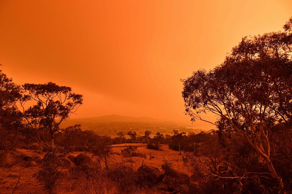 A red sky due to smoke from bushfires hang over the town of Jindabyne in New South Wales. PHOTO: AFP