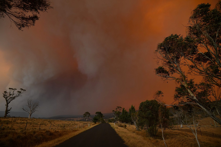 Ember and thick smoke from bushfires reach Braemar Bay in New South Wales. PHOTO: AFP