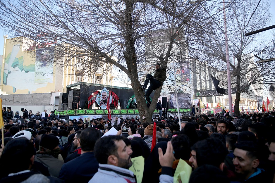Iranian people attend a funeral procession and burial for Iranian Major-General Qassem Soleimani, head of the elite Quds Force, who was killed in an air strike at Baghdad airport, at his hometown in Kerman. PHOTO: Reuters