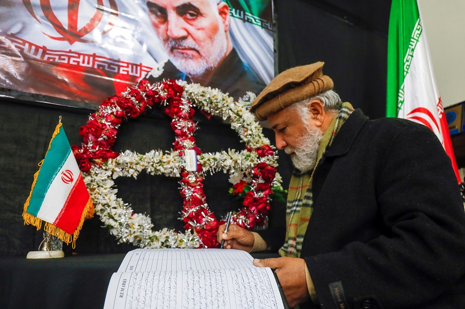 A Pakistani man signs a condolence book for Iranian Major-General Qassem Soleimani, who was killed in a airstrike near Baghdad, at the Consulate General of the Islamic Republic of Iran in Peshawar, Pakistan. PHOTO: Reuters