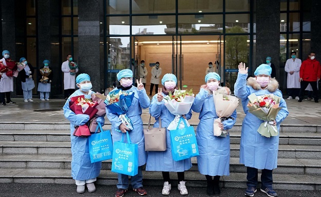 Cured novel coronavirus pneumonia patients, who have received integrated treatment with traditional Chinese medicine (TCM) and Western medicine, are discharged from a hospital in Wuhan, central China's Hubei Province. PHOTO: XINHUA