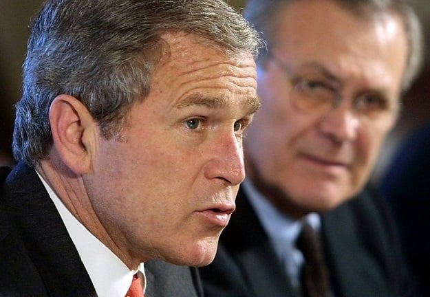 After the September 11, 2001 attacks President George W. Bush (L) cited national security to justify a substantial expansion of his executive power and was later heavily criticized for abuse. PHOTO: AFP