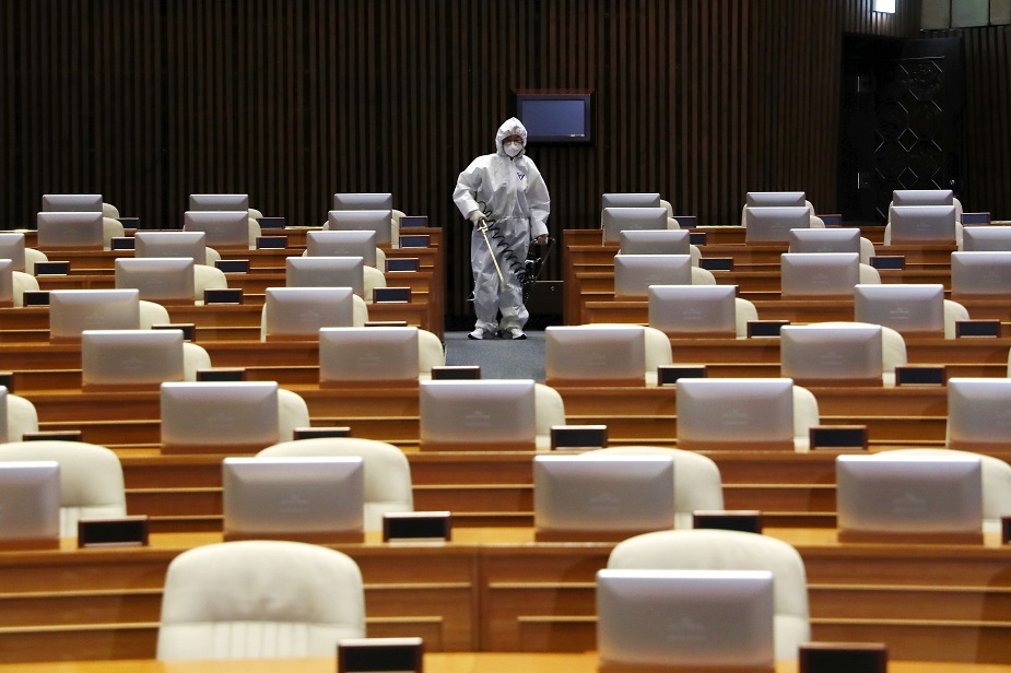 - A worker from the Korea Pest Control Association sprays disinfectant as part of preventive measures against the spread of the COVID-19 coronavirus, at the National Assembly in Seoul on February 25, 2020. - South Korea's parliament cancelled sessions on February 25 as it closed for cleaning after confirmation a person with the coronavirus had attended a meeting last week. It is set to reopen February 26 morning. PHOTO: AFP 