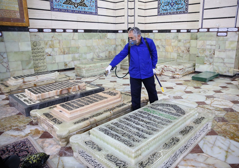 An Iranian sanitary worker disinfects Qom's Masumeh shrine on February 25, 2020 to prevent the spread of the coronavirus which reached Iran, where there were concerns the situation might be worse than officially acknowledged. - The deaths from the disease -- officially known as COVID-19 -- in the Islamic republic were the first in the Middle East and the country's toll with so far a dozen people officially reported dead, is now the highest outside mainland China, the epidemic's epicentre. PHOTO: AFP