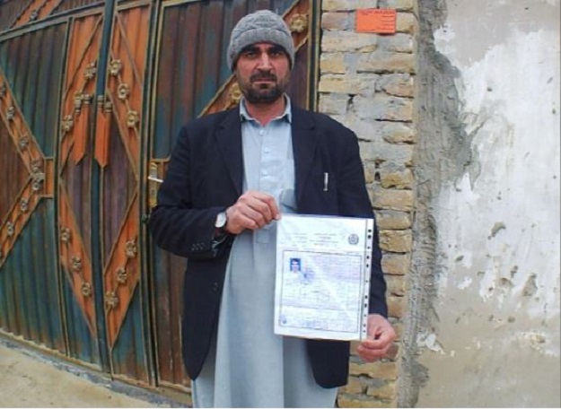 Haji Malik, 47, a shopkeeper who lost his son during the Taliban insurgency in Pakitaka province, poses in Kunduz, Afghanistan February 27, 2020. PHOTO: REUTERS