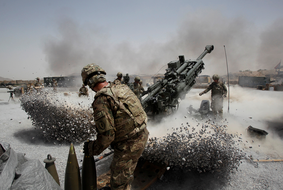 US Army soldiers from the 2nd Platoon, B battery 2-8 field artillery, fire a howitzer artillery piece at Seprwan Ghar forward fire base in Panjwai district, Kandahar province southern Afghanistan, June 12, 2011. PHOTO: REUTERS