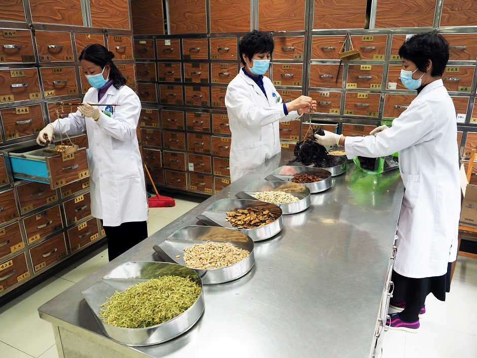 Medical workers prepare traditional Chinese medicine (TCM) at a TCM hospital as the country is hit by an outbreak of the new coronavirus, in Binzhou, Shandong province. PHOTO: Reuters