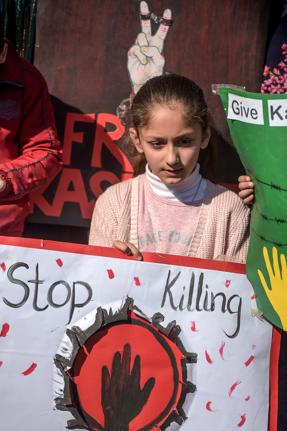 A young girl holds a placard during a demonstration to mark Kashmir Solidarity Day in Islamabad. PHOTO: AFP