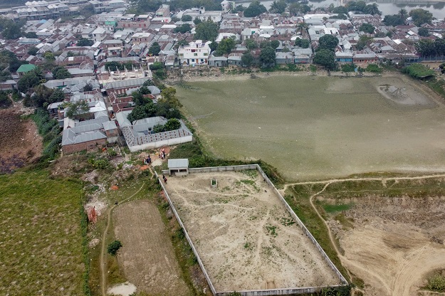 This aerial photograph shows a graveyard (bottom) used for the burial of sex workers in Daulatdia in Rajbari District. PHOTO: AFP