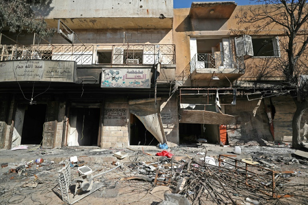 Damaged shops and rubble-strewn streets in the Idlib town of Saraqeb. PHOTO: AFP