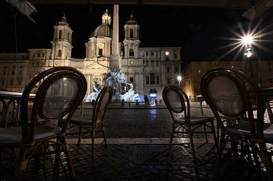 A deserted restaurant terrace is pictured at Piazza Navona in central Rome on March 12, 2020 as Italy shut all stores except for pharmacies and food shops in a desperate bid to halt the spread of a coronavirus. . PHOTO: AFP