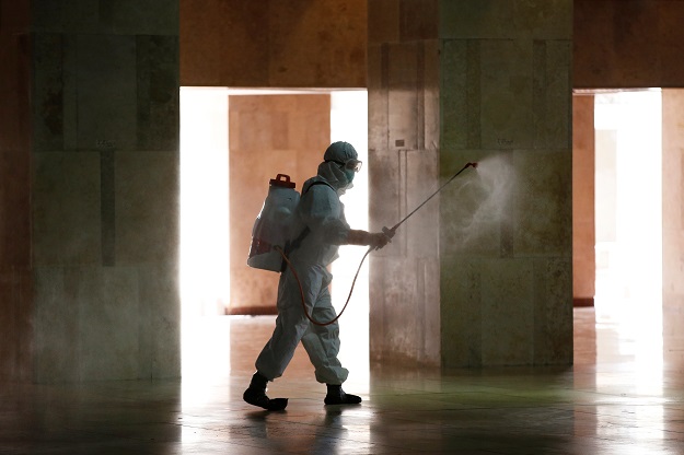 An Indonesian Red Cross personnel sprays disinfectant inside Istiqlal mosque, amid the coronavirus disease (COVID-19) in Jakarta, Indonesia. PHOTO: Reuters