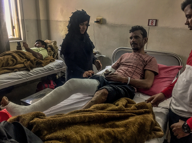 Kaushar Ali, 49, who was beaten up by Delhi police officers on Feb. 24, was visited by his relatives at a hospital earlier this month. PHOTO: The New York Times