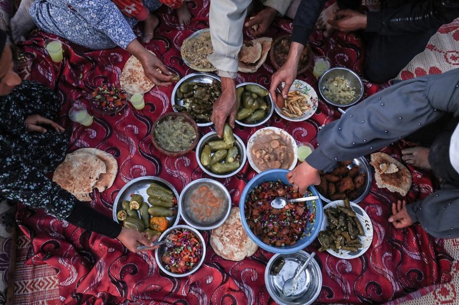 Palestinian family break their fast during iftar dinner of Ramadan in Gaza City, Gaza on April 26, 2020. PHOTO: ANADOLU AGENCY