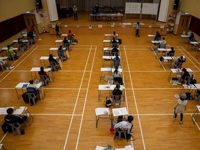 Masked Hong Kong students take final school exams after coronavirus ...